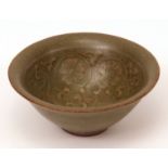 Small Chinese Yaozhou ware bowl with a deep olive green celadon crackle glaze, the interior relief