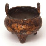 Very heavily cast Chinese bronze censer with upright loop handles on three integral legs, the