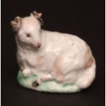 A rare Lowestoft model of a recumbent ram c1780 press moulded with partially glazed base, the ram