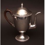 19th century silver on copper coffee pot of polished ovoid form with applied rim and raised on a