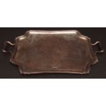 George V two-handled tea tray of waisted rectangular form with cast and applied foliate rim and