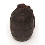 British, 20th century cast iron money-box fashioned from a de-activated and inert "Mill's Bomb"