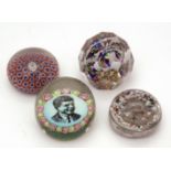 Collection of four paperweights: one inset with a military badge inscribed "East Surrey" and with