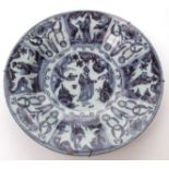 European Delft charger, painted in underglaze blue with central figure motif within radiating border