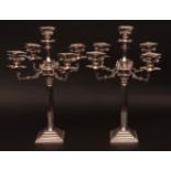 Two first half of 20th century electro-plated five-light candelabra, with central light enclosed