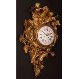 Mid-19th century French cast gilt brass cartel clock, the elaborate case surmounted by putto amongst