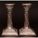 Pair of George V candlesticks, each modelled in the form of a Corinthian column with oak detail,