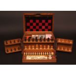 Late 19th/early 20th century oak cased game compendium, "The Royal Cabinet of Games", fitted with