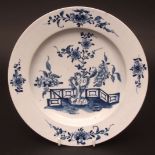 A rare Lowestoft plate c1765 decorated with a Chinese garden scene with flowering tree and fence and