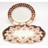 Two Royal Crown Derby platters, one of oval form and one of shaped rectangular form, the former