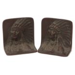 Pair of bronze book-ends, each decorated with head and shoulders portraits of native American