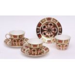 Set of eight Royal Crown Derby modern cups and saucers and one further saucer, typically decorated