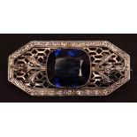 Art Deco precious metal and blue stone brooch, rectangular shaped plaque with canted corners set