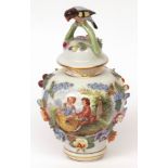 Dresden covered jar of baluster form, the lid crested with handle in the form of a perched bird,