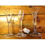 Collection of three 18th century wine glasses, two with trumpet bowls and one with tapering bowl,