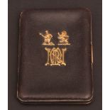 Early 20th century French leather bodied folding card case with hinged and sprung clasp, and cover