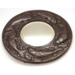 Arts & Crafts copper framed circular wall mirror, the border well embossed with fish and with a