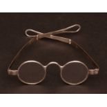 Pair of mid-19th century silver framed spectacles each with circular lenses and hinged arms with