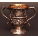 George II two-handled loving cup, of typical flared circular form with girdled body and hollow