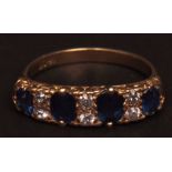 Victorian 18ct gold sapphire and diamond ring, the four oval cut facetted sapphires with two small