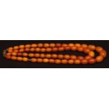 Graduated butterscotch amber coloured double string necklace, with 60 oblong beads (10 to 16mm long)