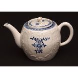 A Lowestoft barrel shaped teapot c1775 crisply moulded in Worcester style with a floral design