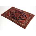 Small Caucasian wool prayer rug, central lozenge, mainly puce and blue field, 45 x 32 ins
