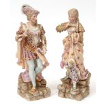 Pair of Dresden figures of a dandy in 18th century costume and his female companion, each painted in