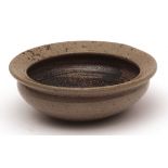 Bernard Leach Studio small circular dish with lipped rim, of tapering form, the foot impressed