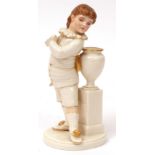 Royal Worcester figure of a young dandy, standing beside an urn, naturalistic flesh colour and