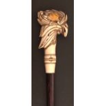Hardwood walking cane, the carved ivory handle in the form of a cockerel’s head, applied on one side