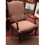 Rosewood simulated Gainsborough style armchair, splayed carved arms decorated with scrolls and