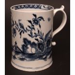 A large Lowestoft mug c1765 of gentle tapered form, painted in dark blue with a Chinese garden scene
