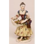 Bow figure of a flower seller (modelled after the Meissen original), formed as a young girl carrying