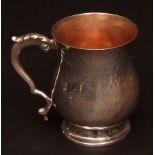 George V tankard, the spot hammered baluster body with leaf-capped cast and applied handle and