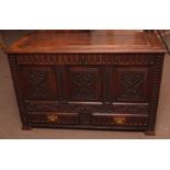 Oak coffer/blanket chest, with three panel front over two frieze drawers, on block feet, front