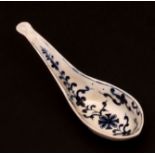 A rare Lowestoft rice or caddy spoon c1775 painted in Worcester style with a Maltese cross design