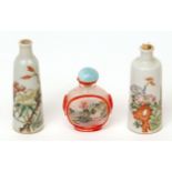 Three Chinese snuff bottles, two of tapered form in porcelain decorated in famille rose enamels with