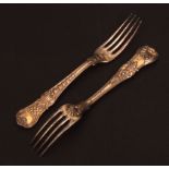 Two George III silver gilt dessert forks, double struck Coburg pattern with oyster heel and with