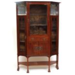 Late 19th/early 20th century Arts & Crafts period mahogany display cabinet, of canted rectangular