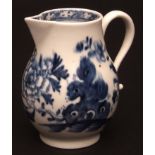A Lowestoft sparrow beak creamer c1770 the pear shaped body painted with rockwork and peony with