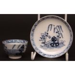 A Lowestoft miniature tea bowl & saucer c1770 painted with a Chinese garden scene with lattice