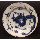 A Lowestoft rare plate c1765 decorated with the dragon pattern, the sinuous dragon chasing the