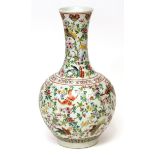 Large Chinese porcelain bulbous bottle vase with flared neck, brightly decorated in famille rose