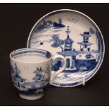 A Lowestoft cup & saucer c1785 painted in light blue with pagodas and a Chinese island scene