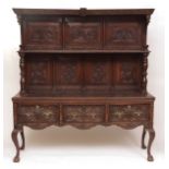 18th century and later oak carved dresser, with panelled back and single shelf, base with three