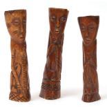 Collection of three primitive type na ve carved horn figures, the largest 7ins high