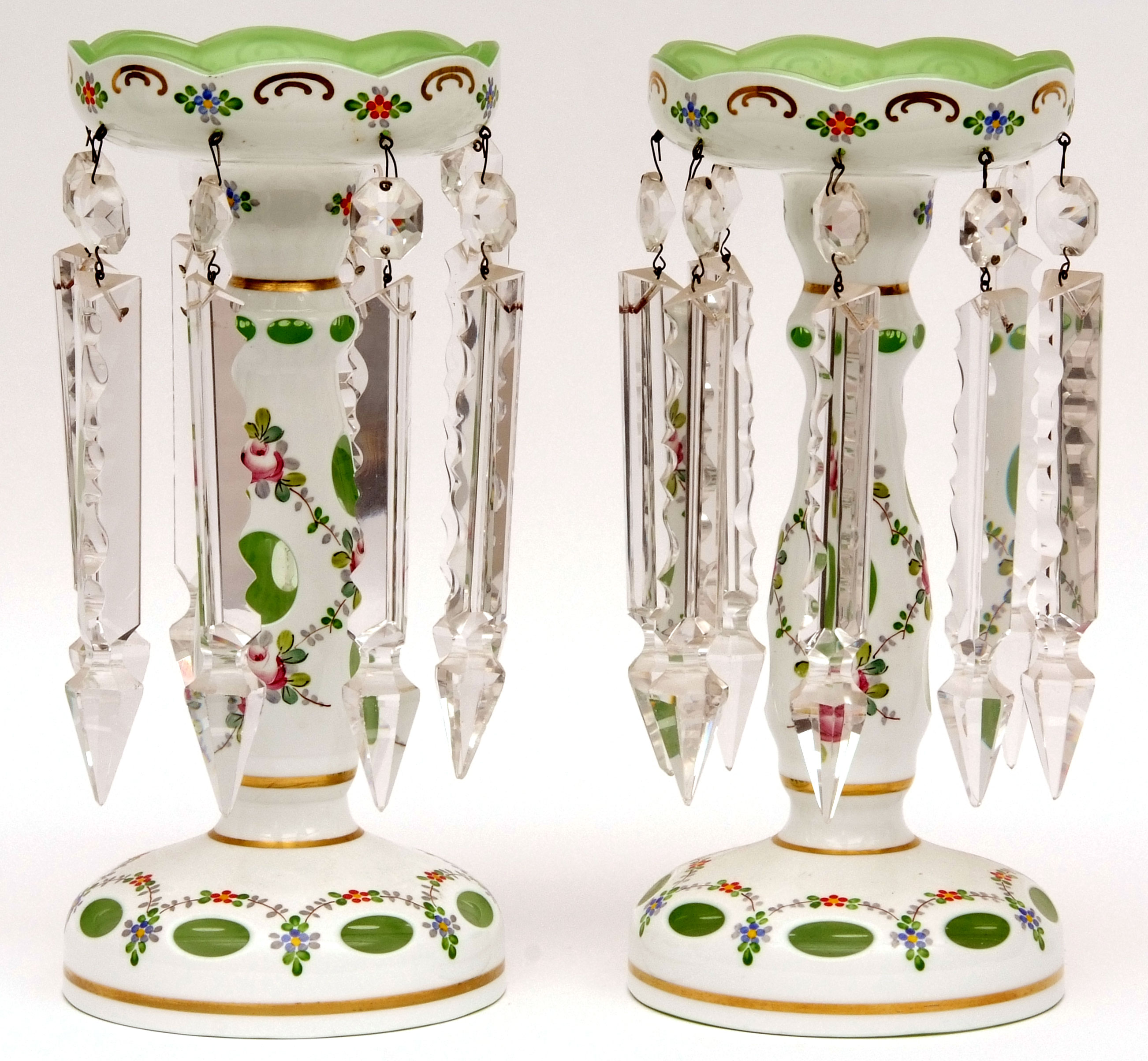 Pair of decorative French overlaid glass lustres, each painted with floral sprigs and sprays in