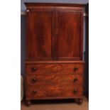 Victorian mahogany linen press with moulded cornice over two panelled doors enclosing a void