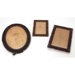 Three Chinese fretted and carved hardwood photo frames, one oval, 12 ins high; one rectangular, 9